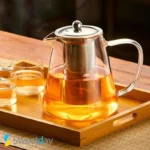 قوری پیرکس گرد شیشه‌ای با درب و صافی استیل